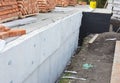 Insulating Exterior Foundation Walls. Foundation Waterproofing and Damp proofing Coatings. Waterproofing house foundation Royalty Free Stock Photo