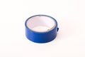 Insulating tape isolated on a white background, blue spool of adhesive electrical tape. Insulating tape for wires, universal Royalty Free Stock Photo