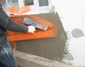 Insulating and waterproofing exterior wall in the window area a building contractor is installing a fiberglass reinforcing