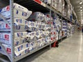 The insulation aisle at Lowes home improvement store with stacks and rolls of attic, wall and basement insulation waiting for