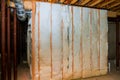 Insulation of basement with fiberglass cold barrier and insulation material