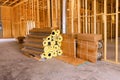 Construction site showcasing stacked insulation rolls boxes in building under renovation Royalty Free Stock Photo