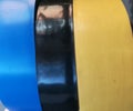 Insulation tape coil close background. multicolored insulating tape