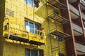 Insulation of the walls of a multi-storey building, The cradle of the lift Royalty Free Stock Photo