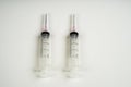 Insulin and large syringe, white background Royalty Free Stock Photo