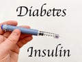 Insulin syringe-pen in hand on a white isolated background. Insulin for diabetics Royalty Free Stock Photo