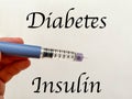 Insulin syringe-pen in hand on a white isolated background. Insulin for diabetics Royalty Free Stock Photo