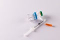 Insulin vial and uncapped syringe on white background with copy space Royalty Free Stock Photo