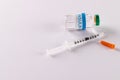 Insulin vial and uncapped syringe on white background with copy space Royalty Free Stock Photo