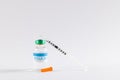 Insulin in vial and uncapped syringe on white background with copy space Royalty Free Stock Photo
