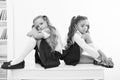 Insult. insult of two small girls children or sisters at school. small girls in school uniform. Royalty Free Stock Photo