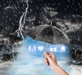 Insurance agent covering illustrations with black umbrella during thunderstorm, closeup Royalty Free Stock Photo