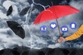 Insurance agent covering illustrations with red umbrella during storm Royalty Free Stock Photo