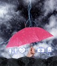 Insurance agent covering illustrations with umbrella during storm Royalty Free Stock Photo