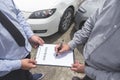 Insurance Agent examine Damaged Car and customer filing signature on Report Claim Form process after accident, Traffic Accident Royalty Free Stock Photo