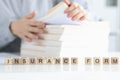 Insurance agent is looking for client insurance form closeup Royalty Free Stock Photo