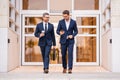 Insurance agent. Two business team men. Man in suit walking across on american office outdoor. Royalty Free Stock Photo