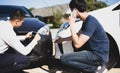 Insurance agents inspect for damage to cars that collide on the road to claim compensation from driving accidents Royalty Free Stock Photo