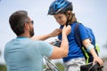 Insurance child. Father teaching son cycling on bike. Father learn little son to ride a bicycle. Father support and Royalty Free Stock Photo