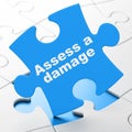 Insurance concept: Assess A Damage on puzzle background