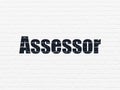 Insurance concept: Assessor on wall background