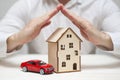 Insurance concept of car insurance, home insurance to protection by hands. House and car insurance concept