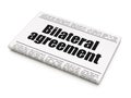 Insurance concept: newspaper headline Bilateral Agreement