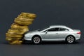 Insurance concept. The toy car crashed into coins. Royalty Free Stock Photo