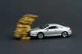 Insurance concept. The toy car crashed into coins. Royalty Free Stock Photo