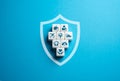 Insurance in the form of a shield of protection. Royalty Free Stock Photo