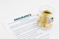 Insurance health questionnaire and coins Royalty Free Stock Photo
