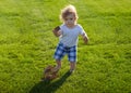 Insurance kids. Baby boy toddler walking in a park on bright spring day.