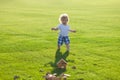 Insurance kids. Happy childhood. Little baby learning to crawl steps on the grass. Concept childrens months. Happy child