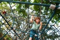 Insurance kids. Little kid boy climbing on the rope at playground. Health care insurance concept for family and children