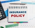 Insurance policy form on desk in office showing risk concept