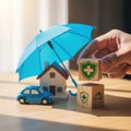 Insurance Protection Concept with Umbrella House Car and Shield Blocks Royalty Free Stock Photo
