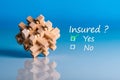 Insure concept. Survey with question Insured. Yes or no. Car, life insurance, home, travel and healt insurance Royalty Free Stock Photo