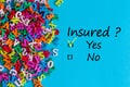 Insured yes or no - Incurance concept with many little letters. question - ARE YOU COVERED