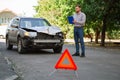 Insurer inspects car and calculates damage after car accident. Man Auto Insurance Agent Inspect vehicle damage condition Royalty Free Stock Photo