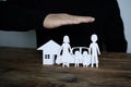 Insurer protecting a family, a house and a car with his hands Royalty Free Stock Photo