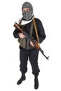 Insurgent dressed in black uniform and black and white shemagh with AK 47 rifle Royalty Free Stock Photo