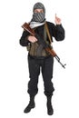 Insurgent dressed in black uniform and black and white shemagh with AK 47 rifle Royalty Free Stock Photo