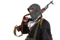 Insurgent dressed in black uniform and black and white shemagh with AK 47 rifle Royalty Free Stock Photo