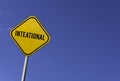 Inteational Earth Day - yellow sign with blue sky background