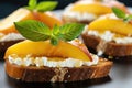 integral bread bruschetta with ricotta topped with peach slices, macro shot