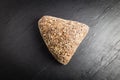 Integral bread in the form of a triangle with linseed, oats and sesame seeds