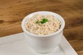 Integral rice cooked  in a white bowl. .Whole grain brown rice Royalty Free Stock Photo