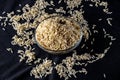 Integral rice on glass bowl isolated on black background