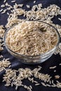 Integral rice on glass bowl isolated on black background