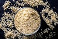 Integral rice on glass bowl isolated on black background